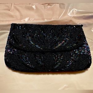 Small beaded Preston and York clutch handbag with a shoulder chain in navy.